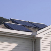 Manifold rooftop heat pipe solar water heater